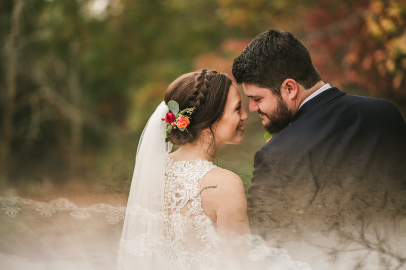 Stunning fall bride and groom just married portraits at The Barn at Pleasant Acres in Maryland. Photo by Britney Clause Photography