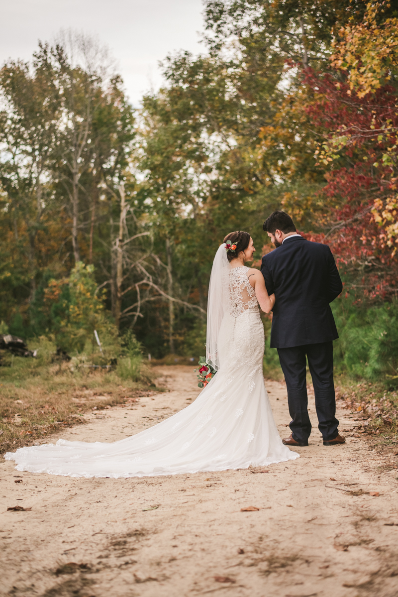 Stunning fall bride and groom just married portraits at The Barn at Pleasant Acres in Maryland. Photo by Britney Clause Photography