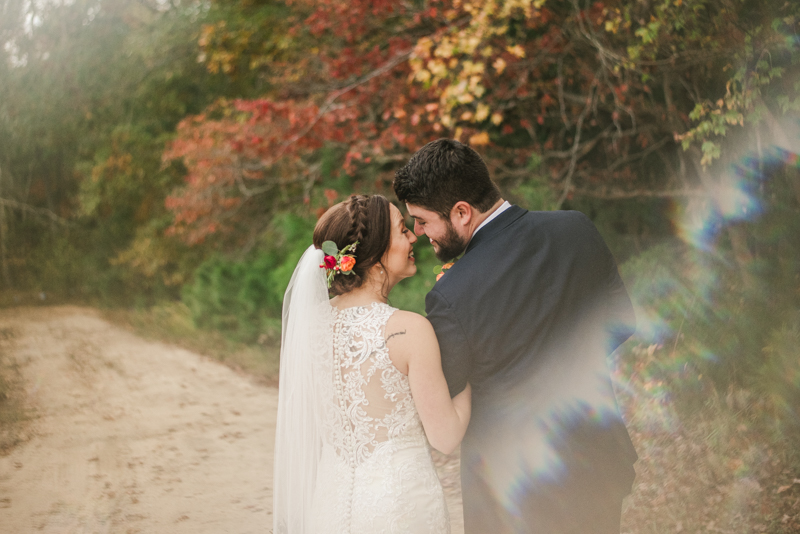 Stunning fall bride and groom just married portraits at The Barn at Pleasant Acres in Maryland. Photo by Britney Clause Photography