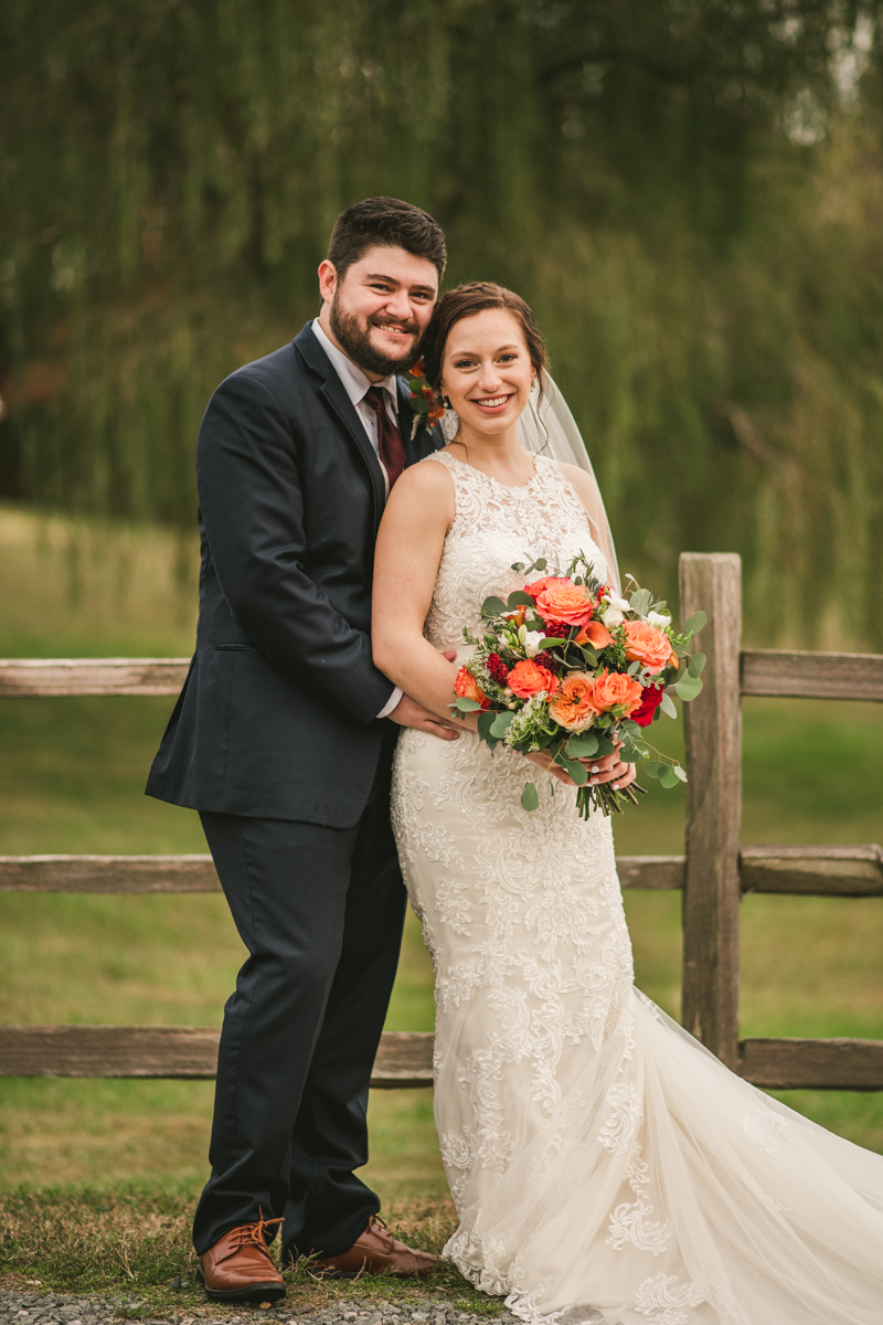 Stunning fall bride and groom just married portraits at The Barn at Pleasant Acres in Maryland. Photo by Britney Clause Photography