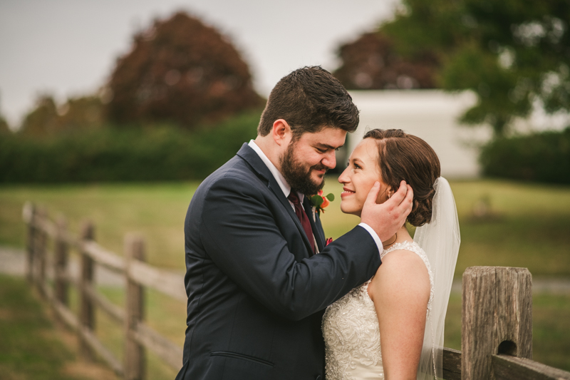 Stunning fall bride and groom just married portraits at The Barn at Pleasant Acres in Maryland. Photo by Britney Clause Photography