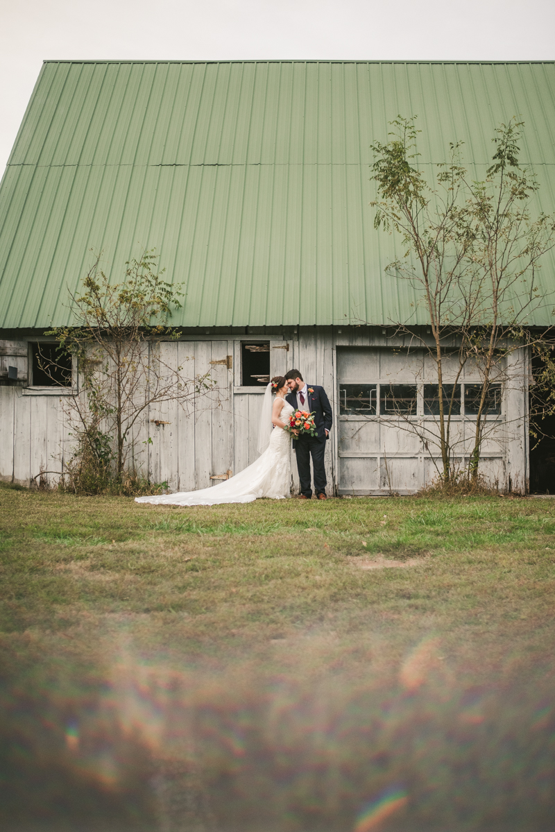 Stunning fall bride and groom just married portraits at The Barn at Pleasant Acres in Maryland. Photo by Britney Clause Photography