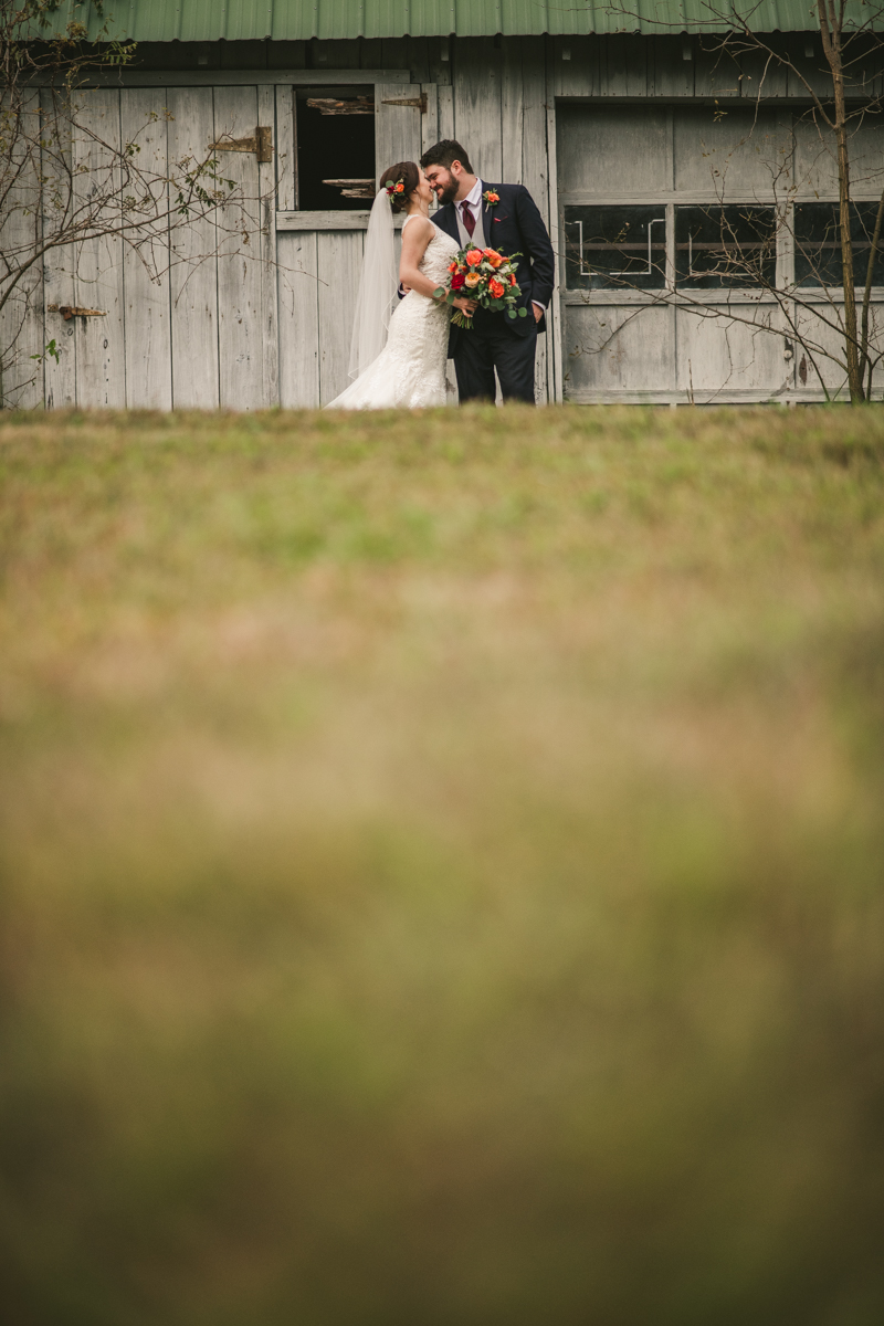 Stunning fall bride and groom just married portraits at The Barn at Pleasant Acres in Maryland. Photo by Britney Clause Photography