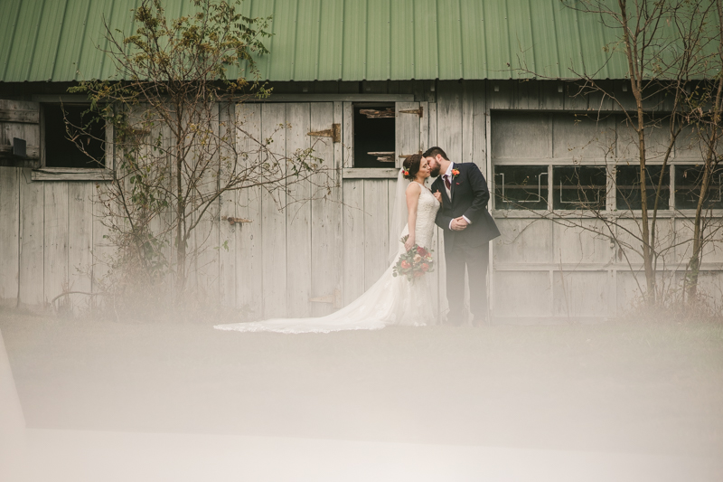 Stunning fall bride and groom just married portraits at The Barn at Pleasant Acres in Maryland. Photo by Britney Clause Photography