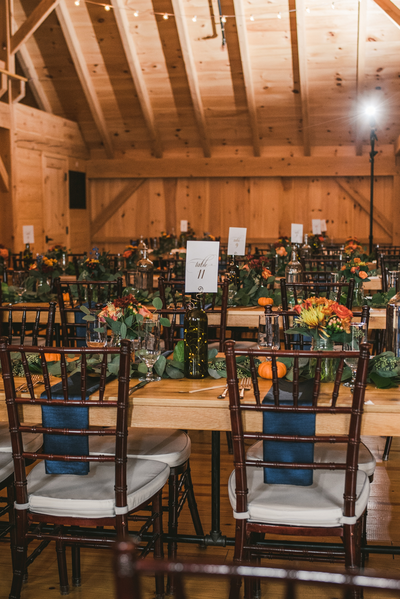Gorgeous fall wedding reception details at The Barn at Pleasant Acres in Maryland. Photo by Britney Clause Photography
