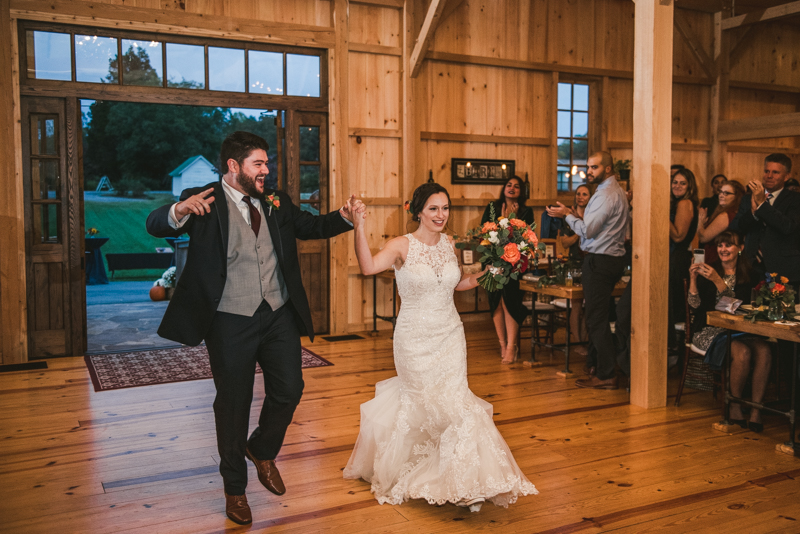 Gorgeous wedding reception at The Barn at Pleasant Acres with music by Washington Talent Agency in Maryland. Photo by Britney Clause Photography