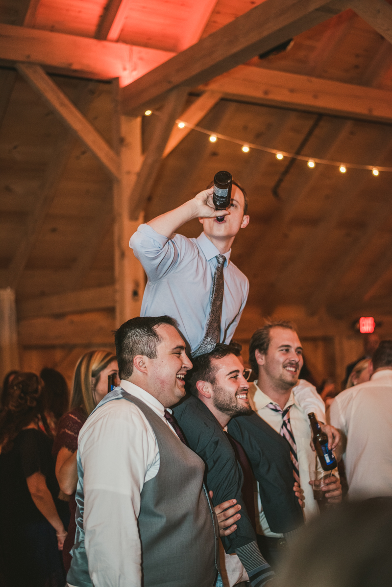 Gorgeous wedding reception at The Barn at Pleasant Acres with music by Washington Talent Agency in Maryland. Photo by Britney Clause Photography