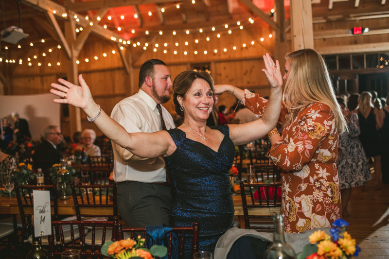 Gorgeous wedding reception at The Barn at Pleasant Acres with music by Washington Talent Agency in Maryland. Photo by Britney Clause Photography