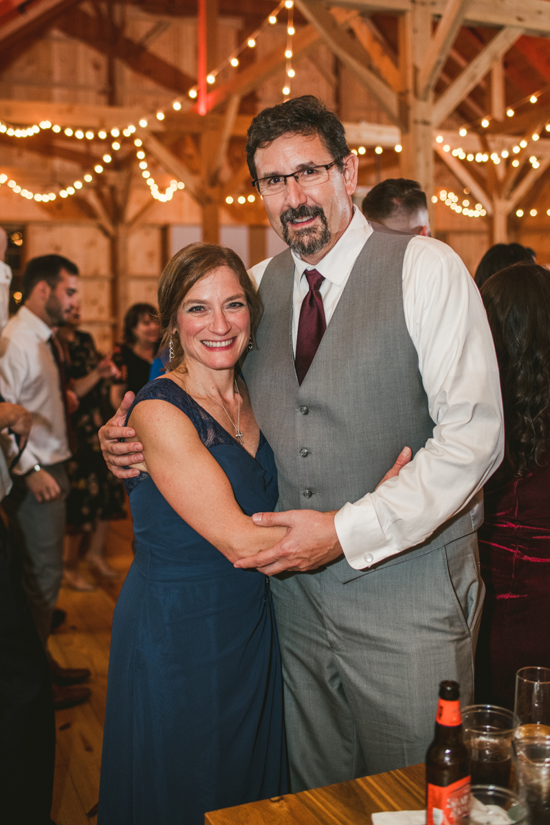 Gorgeous wedding reception at The Barn at Pleasant Acres with music by Washington Talent Agency in Maryland. Photo by Britney Clause Photography