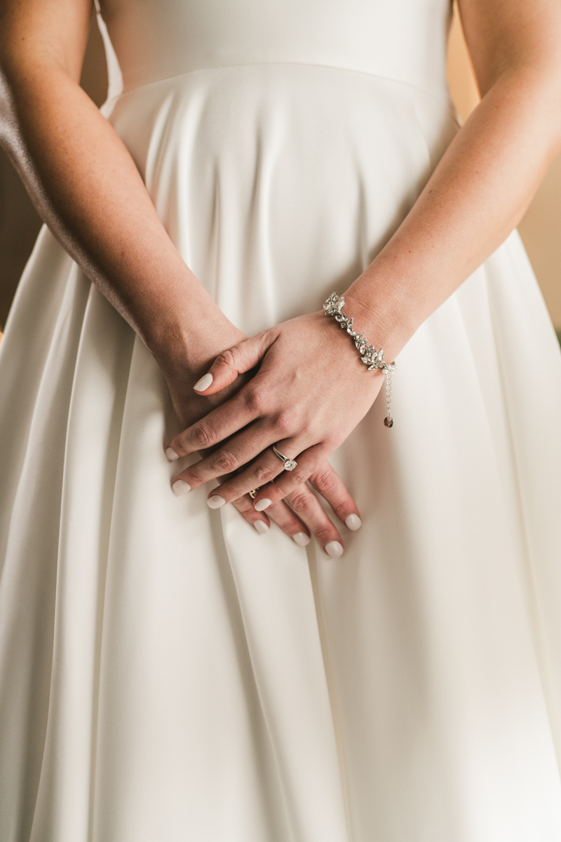 A beautiful wedding dress by Stella York from Garnish Boutique at Mt Washington Mill Dye House in Baltimore, Maryland. Captured by Britney Clause Photography