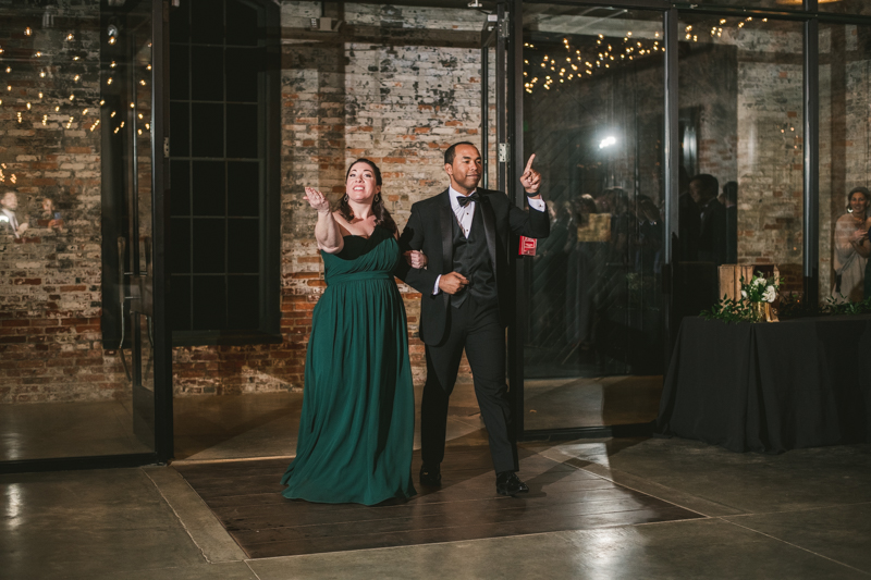 A stylish wedding reception at Mt Washington Mill Dye House in Baltimore, Maryland. Captured by Britney Clause Photography