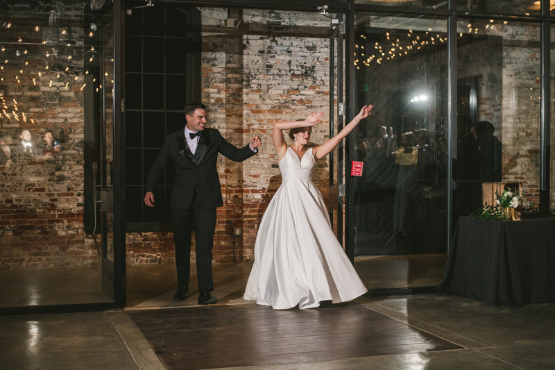 A stylish wedding reception at Mt Washington Mill Dye House in Baltimore, Maryland. Captured by Britney Clause Photography