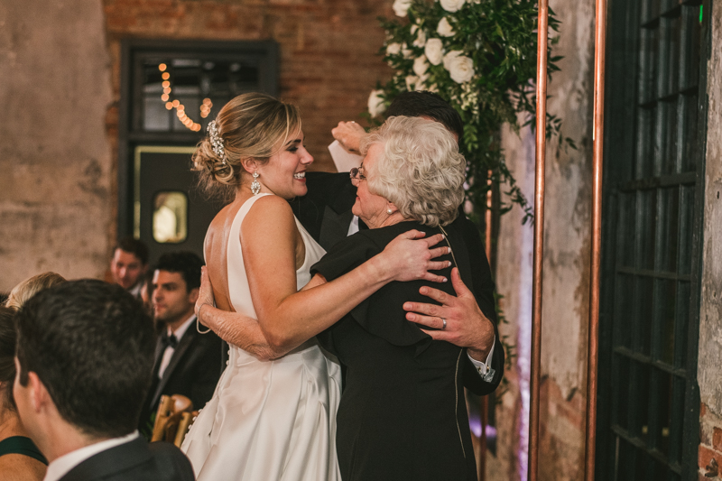 A stylish wedding reception at Mt Washington Mill Dye House in Baltimore, Maryland. Captured by Britney Clause Photography