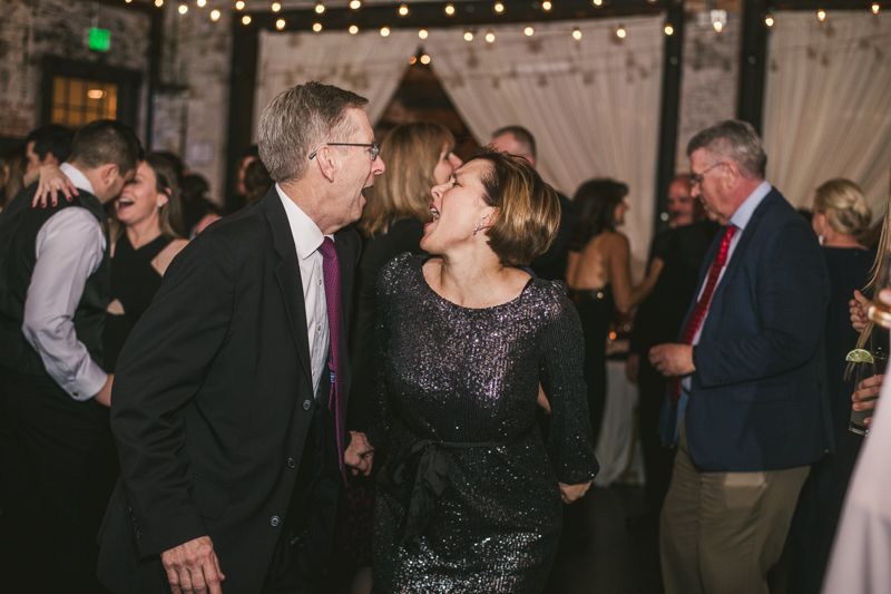 A fun and candid wedding reception at Mt Washington Mill Dye House in Baltimore, Maryland. Captured by Britney Clause Photography