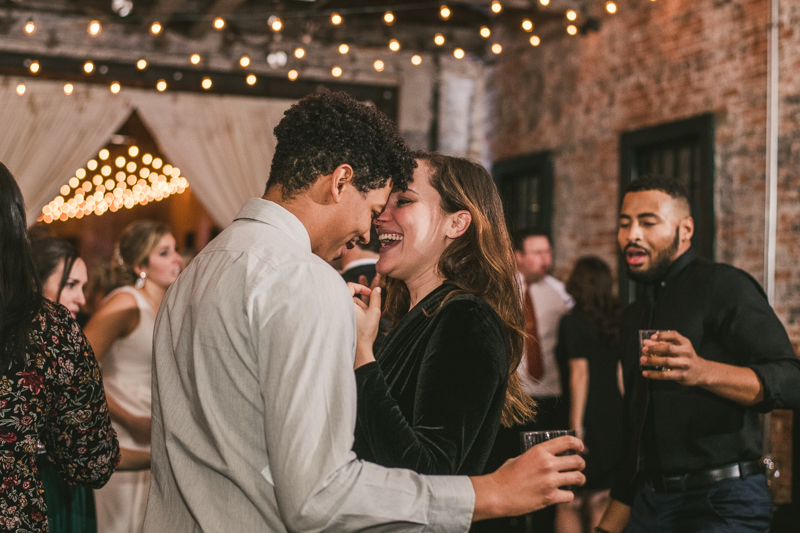 A fun and candid wedding reception at Mt Washington Mill Dye House in Baltimore, Maryland. Captured by Britney Clause Photography