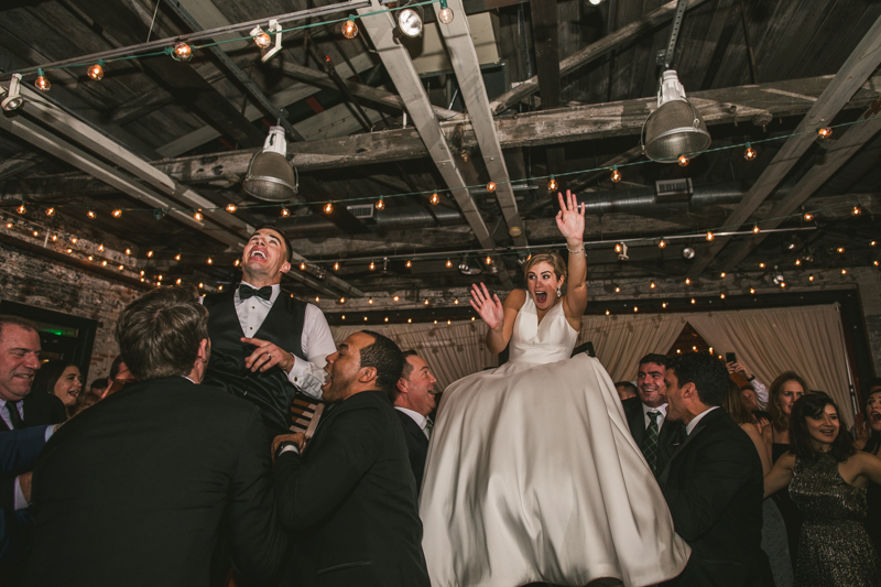 A fun and candid wedding reception at Mt Washington Mill Dye House in Baltimore, Maryland. Captured by Britney Clause Photography