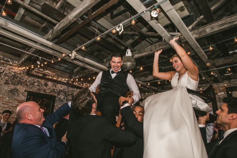 A fun and candid wedding reception at Mt Washington Mill Dye House in Baltimore, Maryland. Captured by Britney Clause Photography