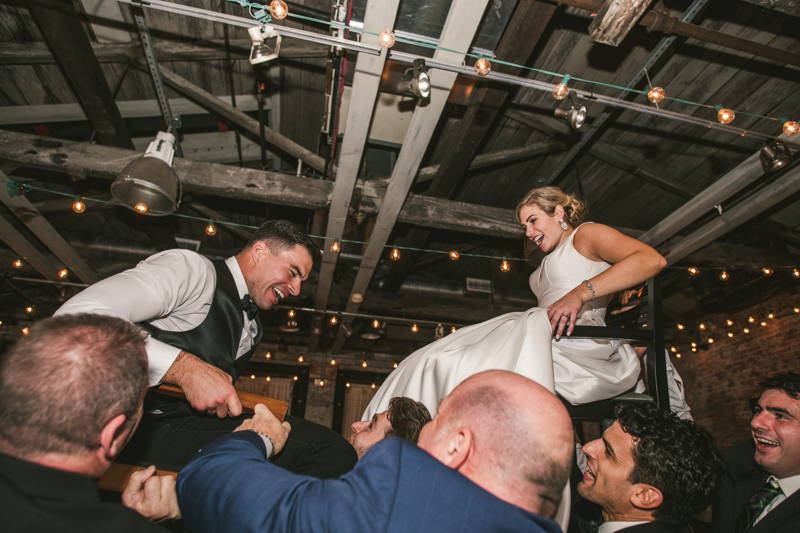 A fun and candid wedding reception at Mt Washington Mill Dye House in Baltimore, Maryland. Captured by Britney Clause Photography