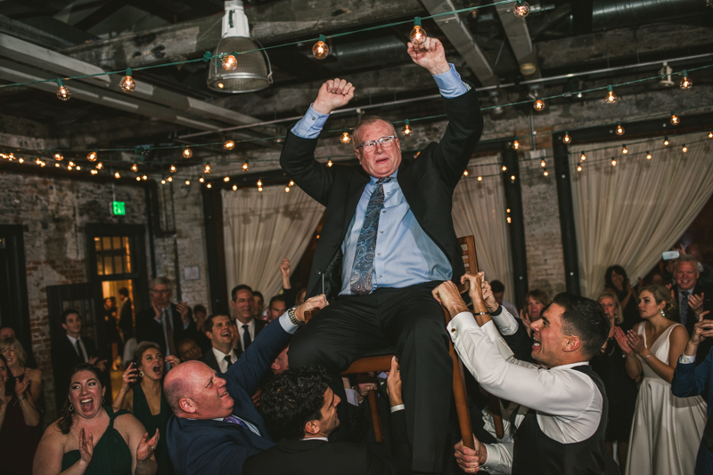 A fun and candid wedding reception at Mt Washington Mill Dye House in Baltimore, Maryland. Captured by Britney Clause Photography