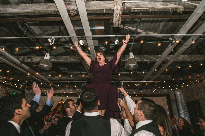 A fun and candid wedding reception at Mt Washington Mill Dye House in Baltimore, Maryland. Captured by Britney Clause Photography