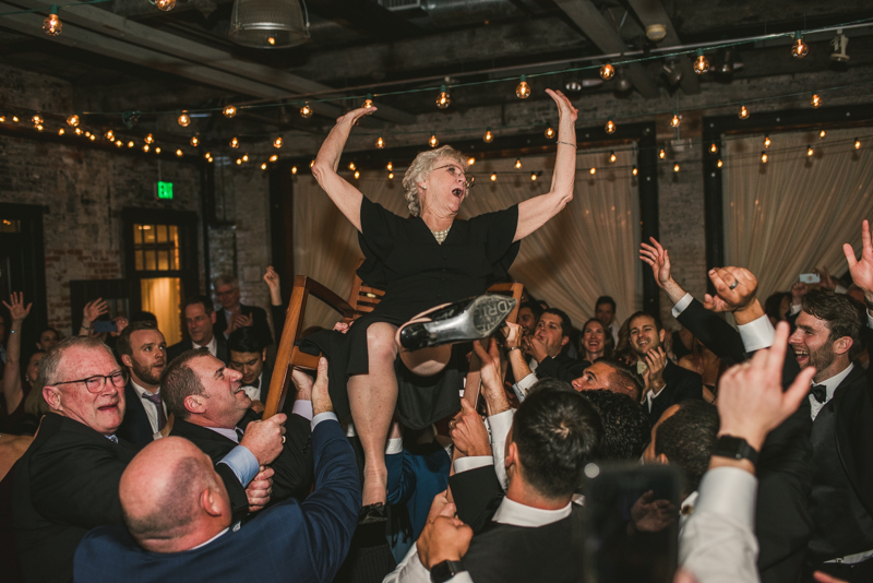 A fun and candid wedding reception at Mt Washington Mill Dye House in Baltimore, Maryland. Captured by Britney Clause Photography