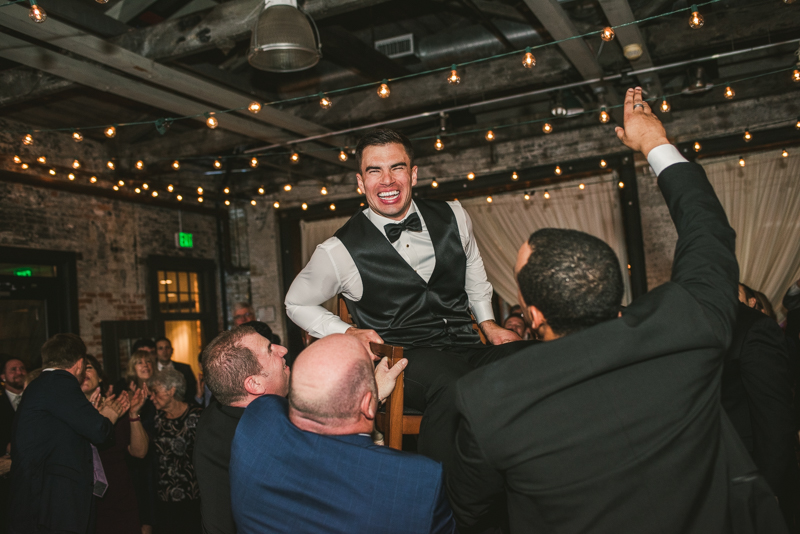 A fun and candid wedding reception at Mt Washington Mill Dye House in Baltimore, Maryland. Captured by Britney Clause Photography