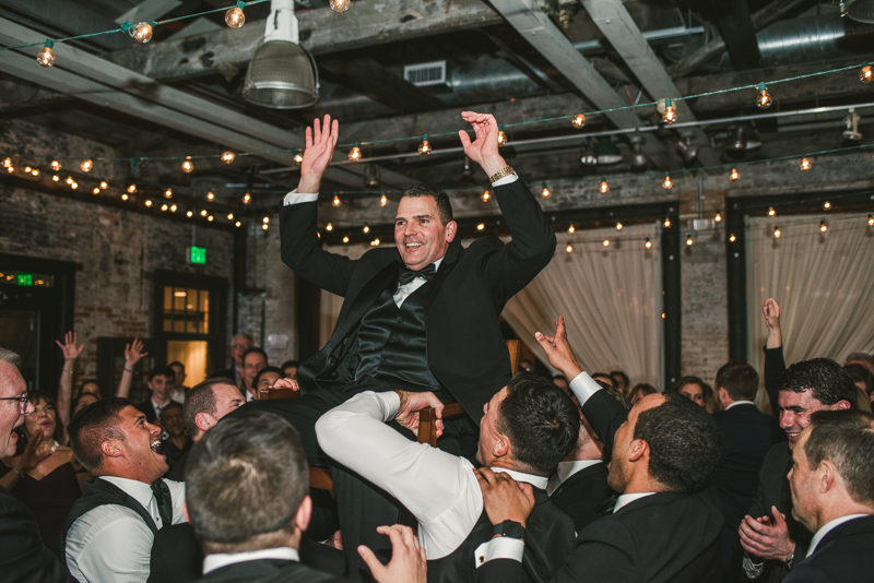 A fun and candid wedding reception at Mt Washington Mill Dye House in Baltimore, Maryland. Captured by Britney Clause Photography