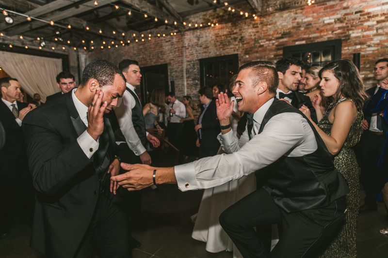 A fun and candid wedding reception at Mt Washington Mill Dye House in Baltimore, Maryland. Captured by Britney Clause Photography