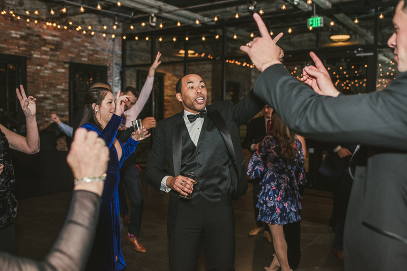 A fun and candid wedding reception at Mt Washington Mill Dye House in Baltimore, Maryland. Captured by Britney Clause Photography