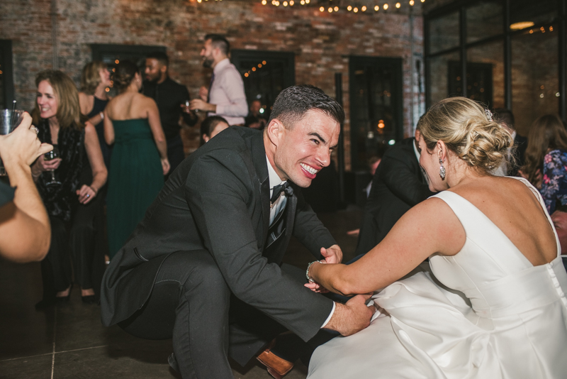 A fun and candid wedding reception at Mt Washington Mill Dye House in Baltimore, Maryland. Captured by Britney Clause Photography