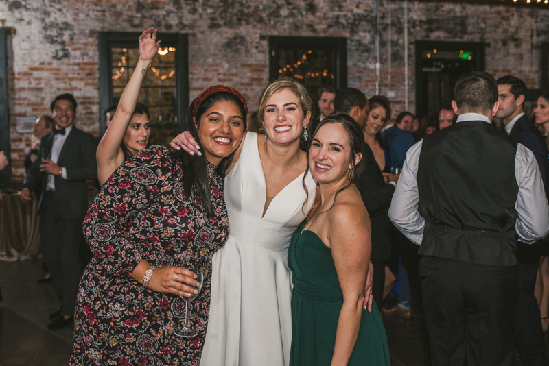 A fun and candid wedding reception at Mt Washington Mill Dye House in Baltimore, Maryland. Captured by Britney Clause Photography