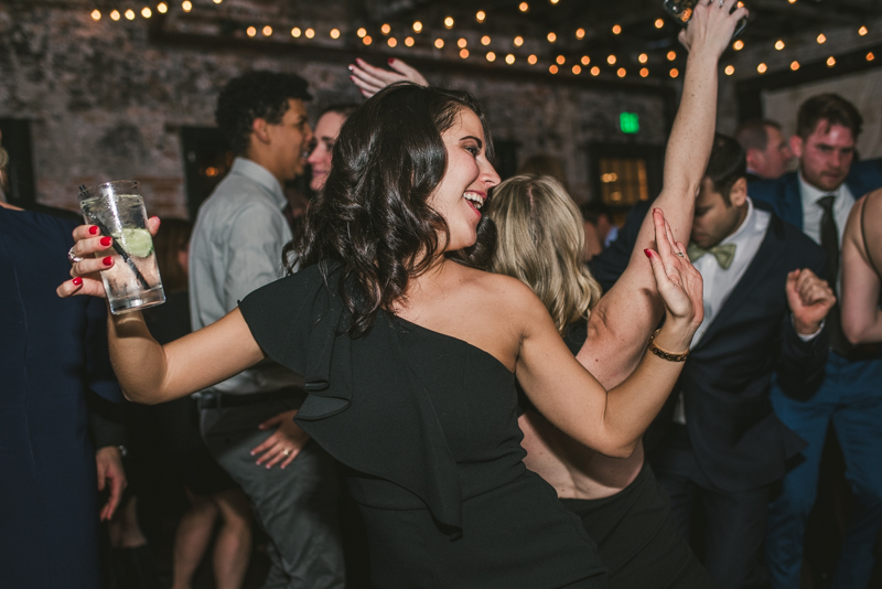 A fun and candid wedding reception at Mt Washington Mill Dye House in Baltimore, Maryland. Captured by Britney Clause Photography