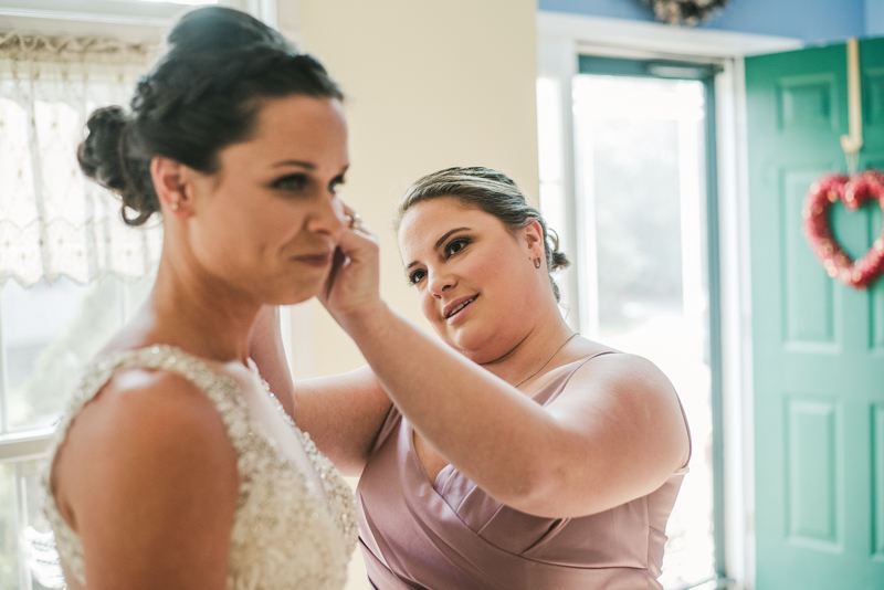 A bride getting ready for her wedding in Pasadena, Maryland by Britney Clause Photography