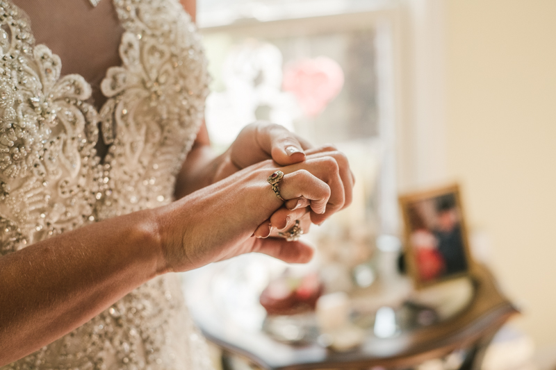 A bride getting ready for her wedding in Pasadena, Maryland by Britney Clause Photography