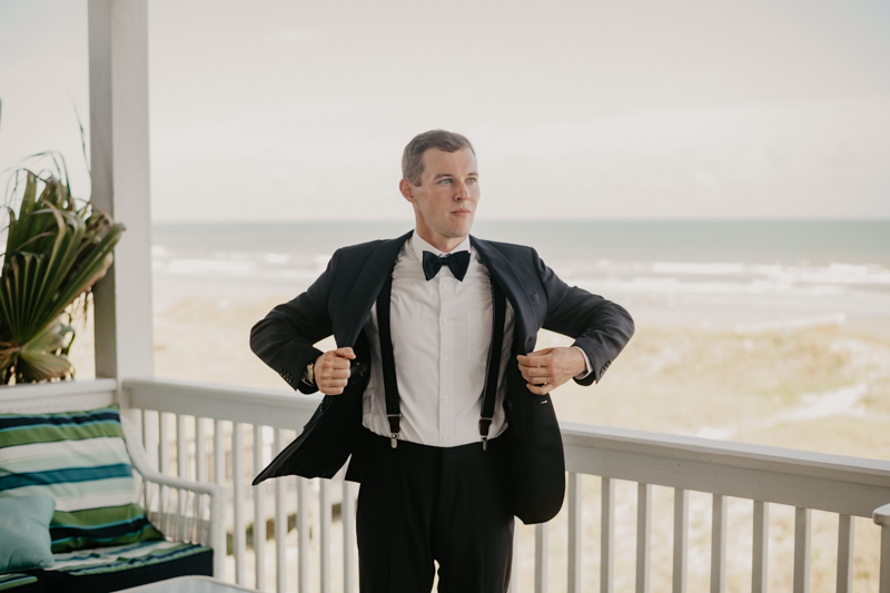 A groom getting ready for his wedding in Folly Beach, South Carolina by Britney Clause Photography