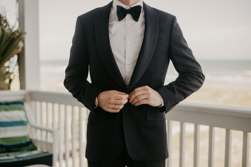 A groom getting ready for his wedding in Folly Beach, South Carolina by Britney Clause Photography