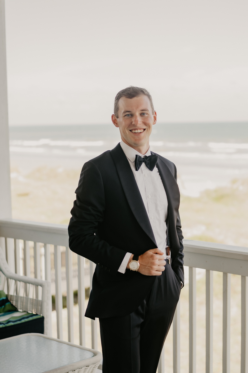 A groom getting ready for his wedding in Folly Beach, South Carolina by Britney Clause Photography