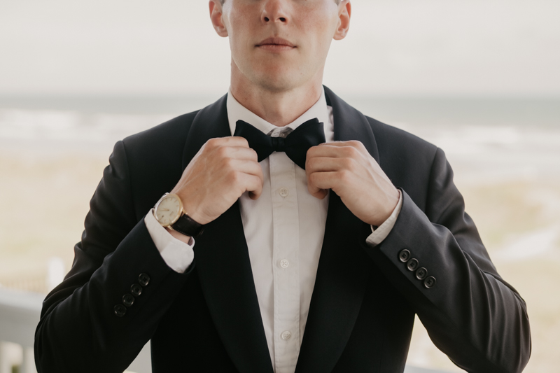 A groom getting ready for his wedding in Folly Beach, South Carolina by Britney Clause Photography