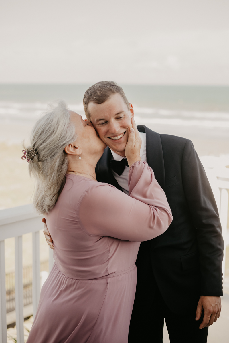 A groom getting ready for his wedding in Folly Beach, South Carolina by Britney Clause Photography