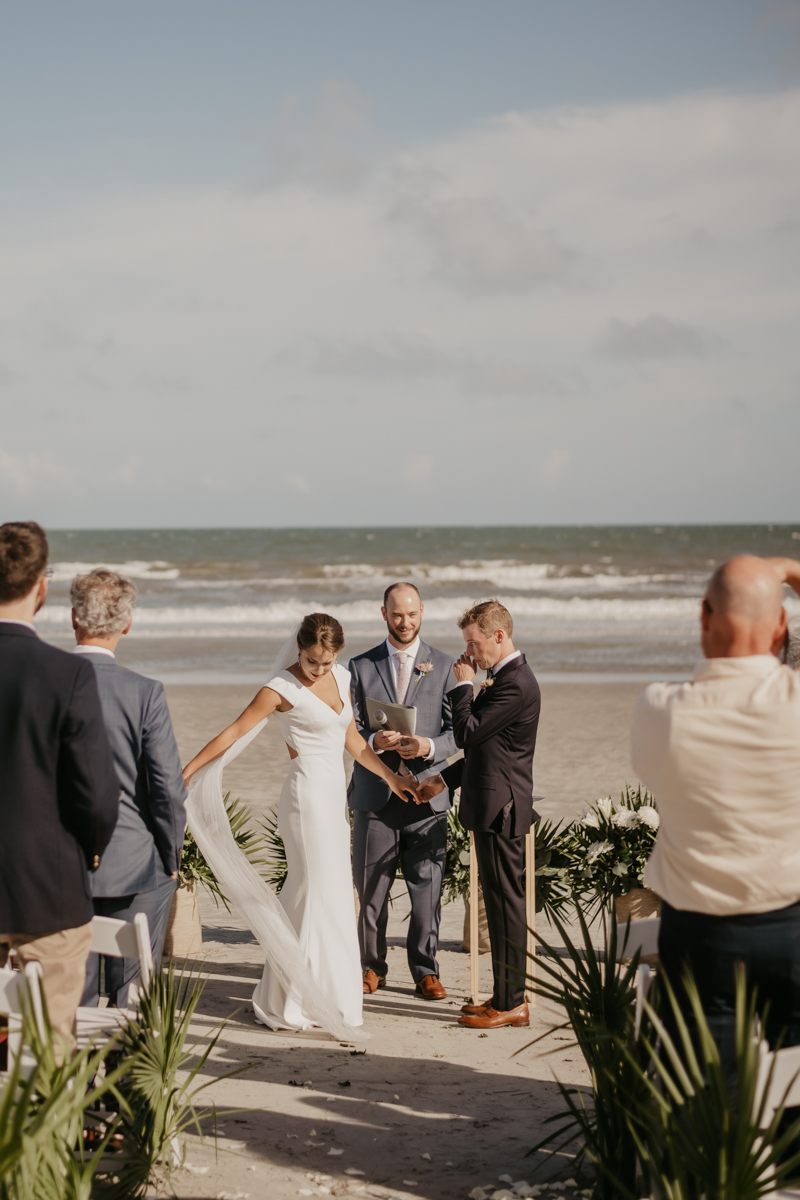 A beautiful beach wedding ceremony in Folly Beach, South Carolina by Britney Clause Photography