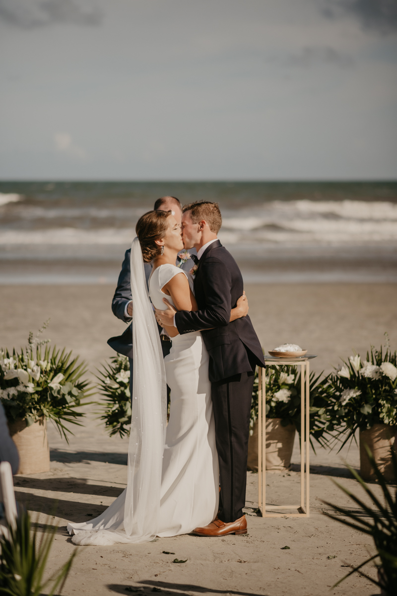 A beautiful beach wedding ceremony in Folly Beach, South Carolina by Britney Clause Photography