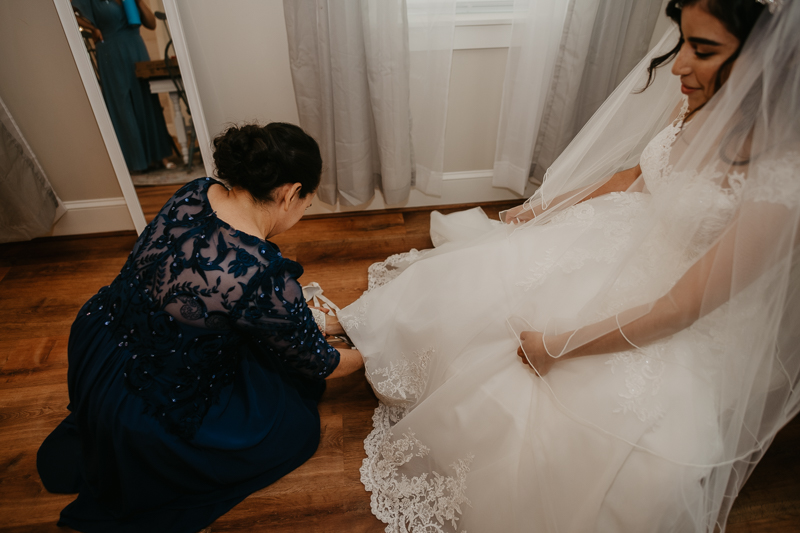 A bride getting ready for her wedding at Historic Rosemont Springs, Virginia by Britney Clause Photography