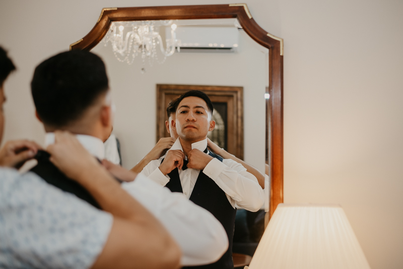 A groom getting ready for his wedding at Historic Rosemont Springs, Virginia by Britney Clause Photography