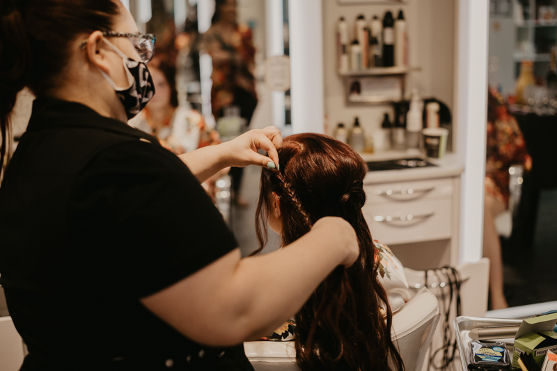 A bride getting ready at Tough Love Salon for her Anchor Inn wedding at in Pasadena, Maryland by Britney Clause Photography