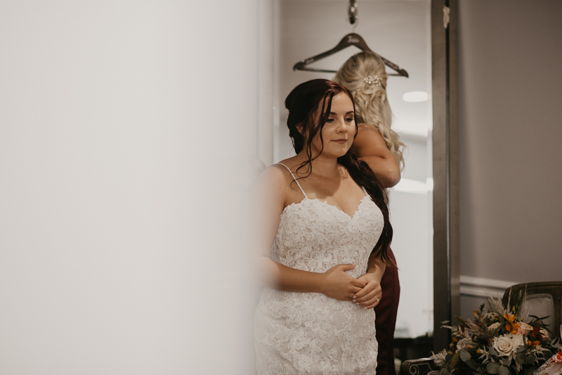 A bride getting ready for her wedding at The Anchor Inn in Pasadena, Maryland by Britney Clause Photography