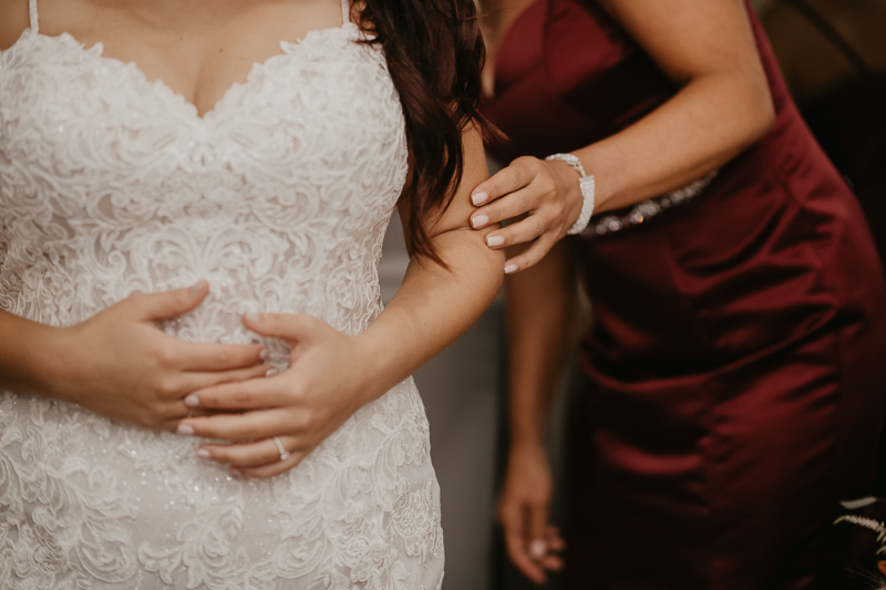 A bride getting ready for her wedding at The Anchor Inn in Pasadena, Maryland by Britney Clause Photography