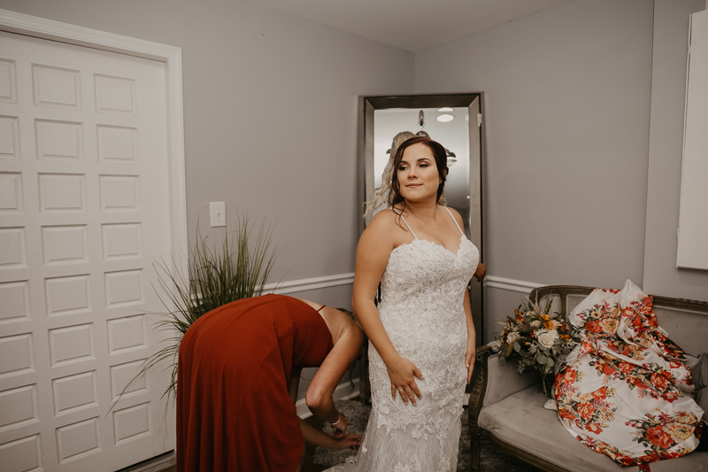 A bride getting ready for her wedding at The Anchor Inn in Pasadena, Maryland by Britney Clause Photography