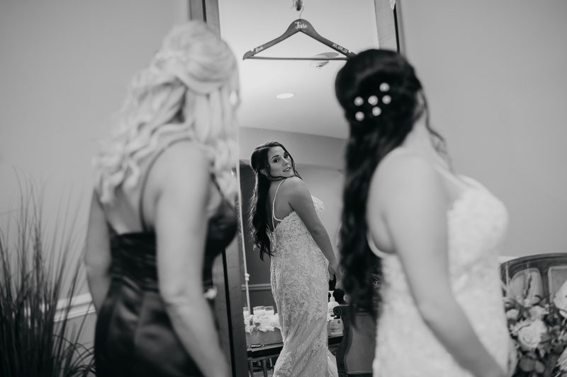 A bride getting ready for her wedding at The Anchor Inn in Pasadena, Maryland by Britney Clause Photography