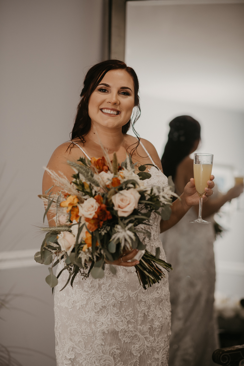 A bride getting ready for her wedding at The Anchor Inn in Pasadena, Maryland by Britney Clause Photography