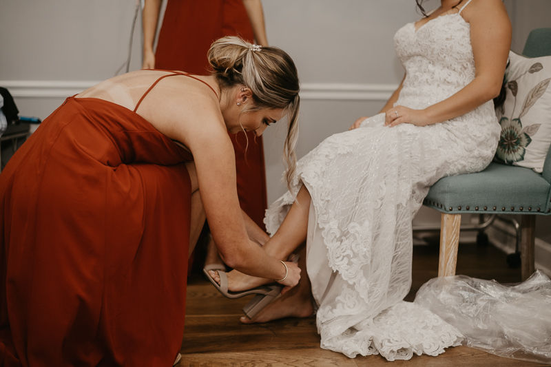 A bride getting ready for her wedding at The Anchor Inn in Pasadena, Maryland by Britney Clause Photography